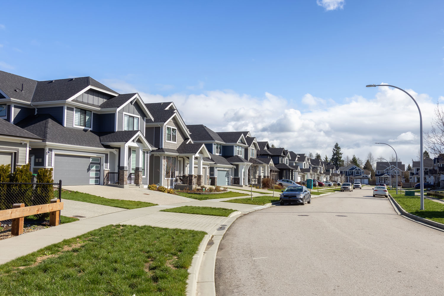 Canadian homes lined along the street to represent the housing market